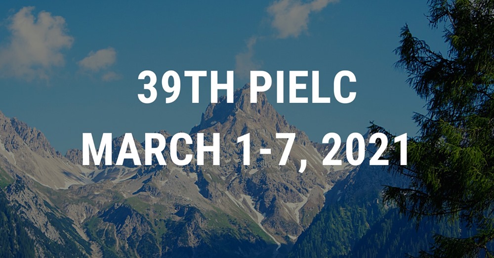 Color photograph of a mountain range on a sunny day with superimposed text that reads: 39th PIELC March 1-7, 2021